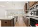 Spacious kitchen with large island, modern stainless steel appliances, and ample cabinet space at 3772 Tielman St, Snellville, GA 30078
