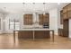Bright open kitchen with a center island, stainless steel appliances, and eat-in area at 3772 Tielman St, Snellville, GA 30078