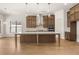 Bright kitchen with a large center island, ample storage, and modern stainless steel appliances at 3772 Tielman St, Snellville, GA 30078