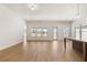 Spacious living room with hardwood floors, recessed lighting, and large windows at 3772 Tielman St, Snellville, GA 30078