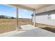 Covered outdoor patio perfect for enjoying the expansive backyard and serene views at 3772 Tielman St, Snellville, GA 30078