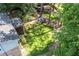 Aerial view of backyard with lush lawn, mature trees, play area, and sports area at 3824 N Cooper Lake Se Rd, Smyrna, GA 30082