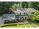 Front exterior of two-story house, showcasing well-maintained landscaping and charming curb appeal at 3824 N Cooper Lake Se Rd, Smyrna, GA 30082