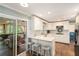 Well-appointed kitchen with an island, stainless steel appliances, and access to an outdoor space, enhancing convenience and style at 3824 N Cooper Lake Se Rd, Smyrna, GA 30082
