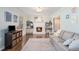 Cozy living room showcasing a brick fireplace with built-in shelving and hardwood floors at 3824 N Cooper Lake Se Rd, Smyrna, GA 30082