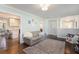 Bright living room featuring hardwood floors, neutral paint, and lots of natural light at 3824 N Cooper Lake Se Rd, Smyrna, GA 30082