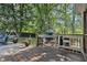 Inviting outdoor area featuring a built-in grilling station and patio with a charming swing at 3824 N Cooper Lake Se Rd, Smyrna, GA 30082