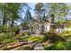 A spacious backyard surrounded by lush greenery and mature trees at 6990 Brandon Mill Nw Rd, Atlanta, GA 30328