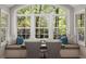 Cozy breakfast nook with a window seat overlooking lush greenery at 6990 Brandon Mill Nw Rd, Atlanta, GA 30328