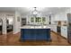 Spacious kitchen with an island, granite countertops, and modern stainless steel appliances at 6990 Brandon Mill Nw Rd, Atlanta, GA 30328