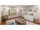 Bright living area featuring hardwood floors, shutters, and stylish decor at 6990 Brandon Mill Nw Rd, Atlanta, GA 30328