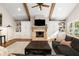 Comfortable living room featuring a fireplace, built-in shelving, and hardwood floors at 6990 Brandon Mill Nw Rd, Atlanta, GA 30328