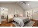 Bright main bedroom boasts a ceiling fan and ample natural light, with a view of an ensuite bathroom and office at 6990 Brandon Mill Nw Rd, Atlanta, GA 30328