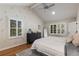 Serene main bedroom featuring hardwood floors, and natural light, creating a relaxing and inviting atmosphere at 6990 Brandon Mill Nw Rd, Atlanta, GA 30328