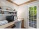Bright home office with built-in shelves and a door leading to an outdoor deck at 6990 Brandon Mill Nw Rd, Atlanta, GA 30328