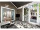 Inviting screened-in porch with comfortable seating, and string lights creating a cozy outdoor living space at 6990 Brandon Mill Nw Rd, Atlanta, GA 30328