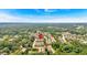 Stunning aerial view of townhome community, surrounded by lush green trees and serene landscapes under a clear blue sky at 2281 Millhaven Se St # 18, Smyrna, GA 30080