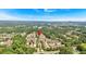 Scenic aerial view of a community neighborhood with mature trees and lush green spaces with a distant city skyline at 2281 Millhaven Se St # 18, Smyrna, GA 30080