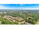 Expansive aerial view of townhome community in a green suburban area with city skyline visible at 2281 Millhaven Se St # 18, Smyrna, GA 30080