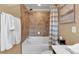 Bathroom features a shower-tub combo with neutral tile and modern fixtures at 2281 Millhaven Se St # 18, Smyrna, GA 30080