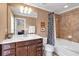 Full bathroom with vanity, tub, shower, and decorative lighting at 2281 Millhaven Se St # 18, Smyrna, GA 30080