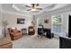 Comfortable bedroom with neutral tones, a ceiling fan, and a well-lit desk area at 2281 Millhaven Se St # 18, Smyrna, GA 30080