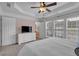 Bright bedroom featuring a plush bed, soft carpet, and large windows with natural light at 2281 Millhaven Se St # 18, Smyrna, GA 30080