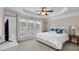 Bright bedroom featuring a plush bed, soft carpet, and large windows with natural light at 2281 Millhaven Se St # 18, Smyrna, GA 30080