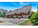Exterior of well-maintained townhomes with individual garages, private decks, and landscaped grounds at 2281 Millhaven Se St # 18, Smyrna, GA 30080