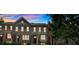 Charming two-story townhouse with a welcoming front porch and well-manicured landscaping at 2281 Millhaven Se St # 18, Smyrna, GA 30080