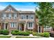 Charming townhouse featuring a well-maintained front yard with lush greenery and a welcoming entrance at 2281 Millhaven Se St # 18, Smyrna, GA 30080