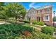 Well-maintained townhome featuring a manicured lawn and vibrant landscaping at 2281 Millhaven Se St # 18, Smyrna, GA 30080
