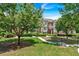 Beautiful townhome with a lush green lawn, mature trees, and a charming walkway at 2281 Millhaven Se St # 18, Smyrna, GA 30080