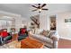 Spacious living room with a ceiling fan, plush seating, and staircase view at 2281 Millhaven Se St # 18, Smyrna, GA 30080