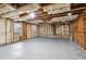 Unfinished basement with visible insulation and a concrete floor, ready for customization at 326 Oakview Way, Canton, GA 30114
