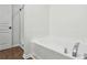 Bathroom featuring a soaking tub with chrome fixtures at 326 Oakview Way, Canton, GA 30114