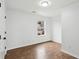 Bedroom with wood flooring and a window view of neighboring homes at 326 Oakview Way, Canton, GA 30114
