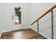 Bright entryway featuring wood floors, white walls, modern staircase, and a door with views of the outdoors at 326 Oakview Way, Canton, GA 30114