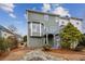 Exterior back view featuring a deck and bay windows surrounded by mature landscaping at 326 Oakview Way, Canton, GA 30114
