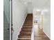 Hallway with beautiful hardwood floors leading to a staircase and bright living spaces at 326 Oakview Way, Canton, GA 30114