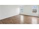 Main bedroom with light hardwood floors and two windows at 326 Oakview Way, Canton, GA 30114