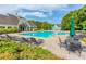 Relax at this neighborhood pool with lounge chairs, tables, umbrellas, and beautiful trees at 326 Oakview Way, Canton, GA 30114