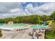 Aerial view of the community pool with a waterslide and multiple lounge areas at 326 Oakview Way, Canton, GA 30114