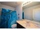 Bathroom features a shower with curtain and a single sink vanity with plenty of counter space at 917 Revere Way, Hampton, GA 30228