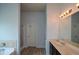 Bathroom features a double sink with vanity, large mirror, tub, and separate shower with glass door at 917 Revere Way, Hampton, GA 30228