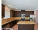 Well-equipped kitchen featuring granite counters, stainless steel appliances, and center island at 917 Revere Way, Hampton, GA 30228