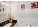 Half bathroom with gray striped walls, modern sink, and stylish decorative accents at 135 Clubhouse Nw Dr, Kennesaw, GA 30144