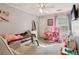 Bright bedroom with ample space, ceiling fan, and TV, perfect for playing and resting at 135 Clubhouse Nw Dr, Kennesaw, GA 30144