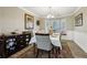 Elegant dining room featuring a bay window, hardwood floors, and traditional décor at 135 Clubhouse Nw Dr, Kennesaw, GA 30144
