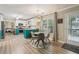 Bright and airy kitchen features an eat-in area and access to outdoor patio at 135 Clubhouse Nw Dr, Kennesaw, GA 30144